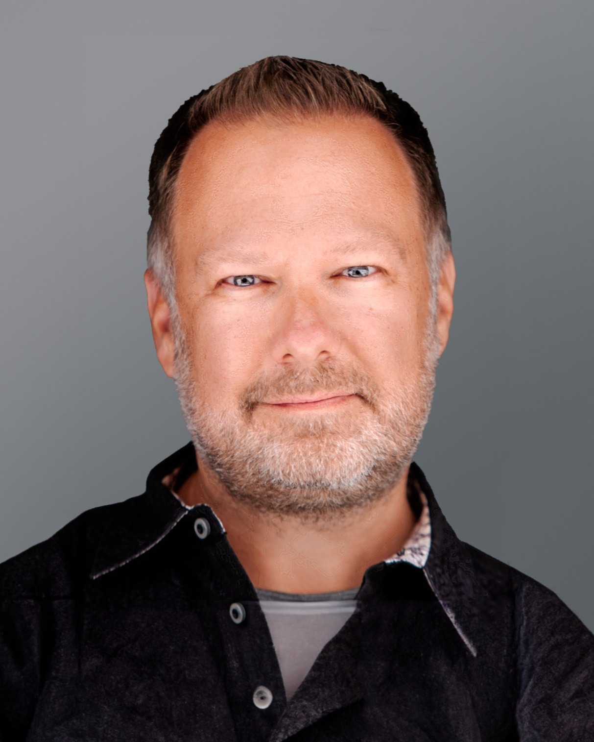 Kevin_ocragly_headshot_AIAdjusted-1