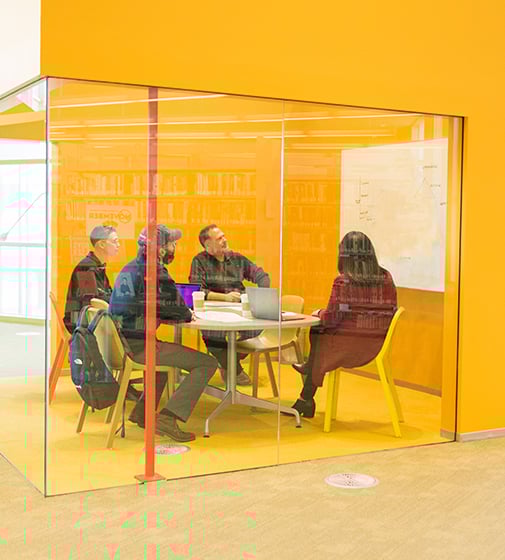 Intevity employees in a meeting
