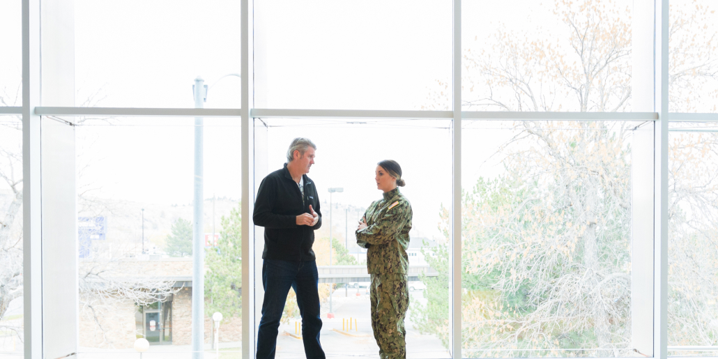 Intevity employee speaking with a government official