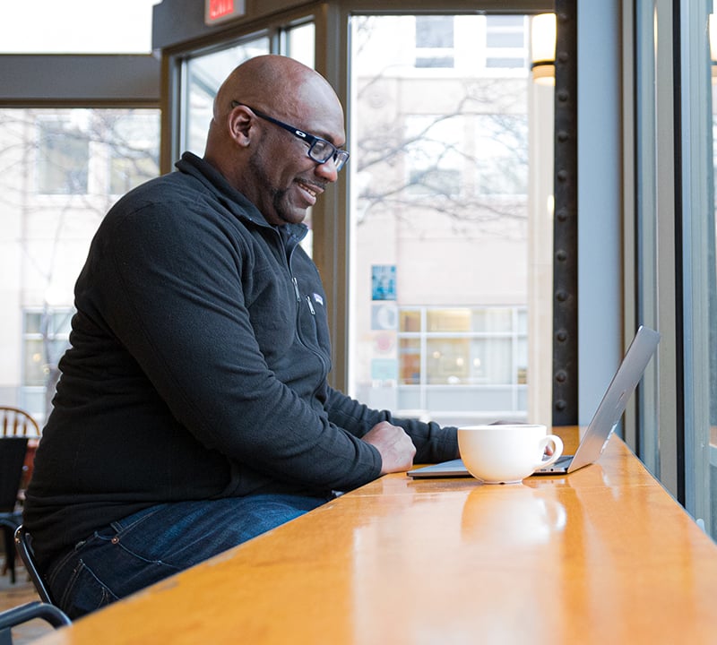 Intevity Employee working virtually from Coffee Shop