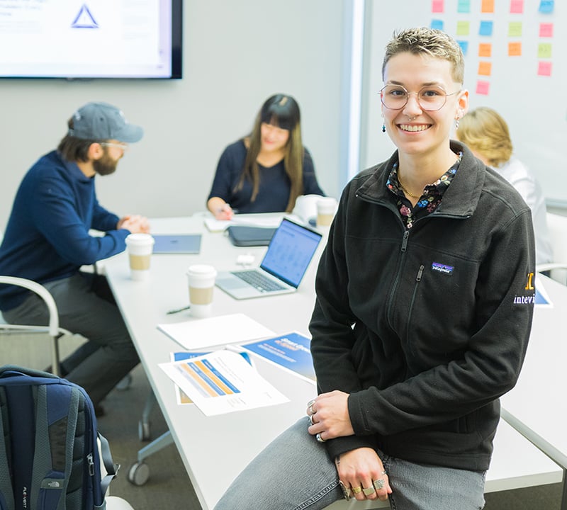 Intevity employees working in a team